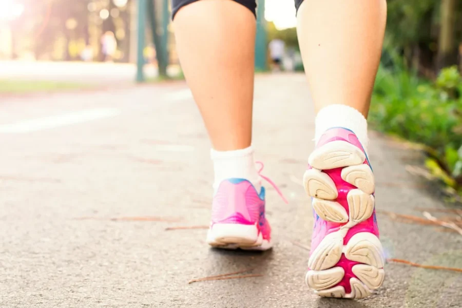 Woman trainers walking city