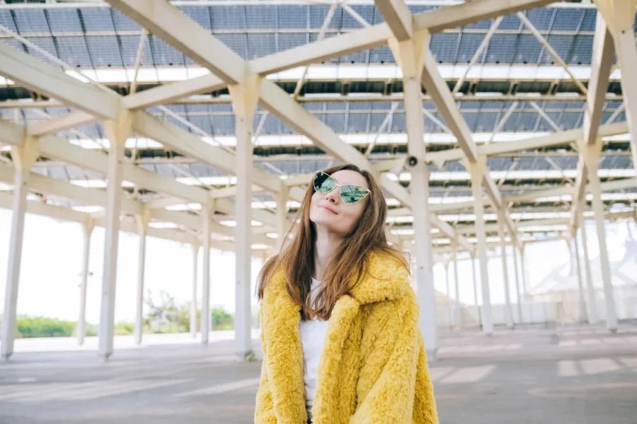 Stylish woman sunglasses bright street