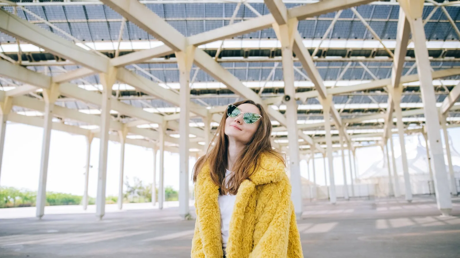 Stylish woman sunglasses bright street