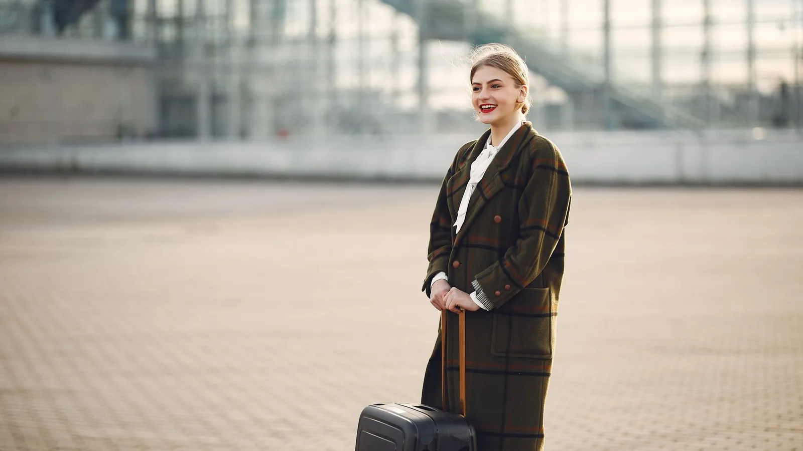Happy woman airport travel outfit