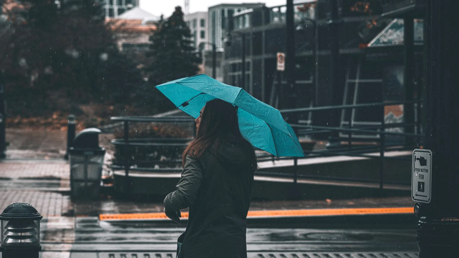 Bright raincoat woman city rain