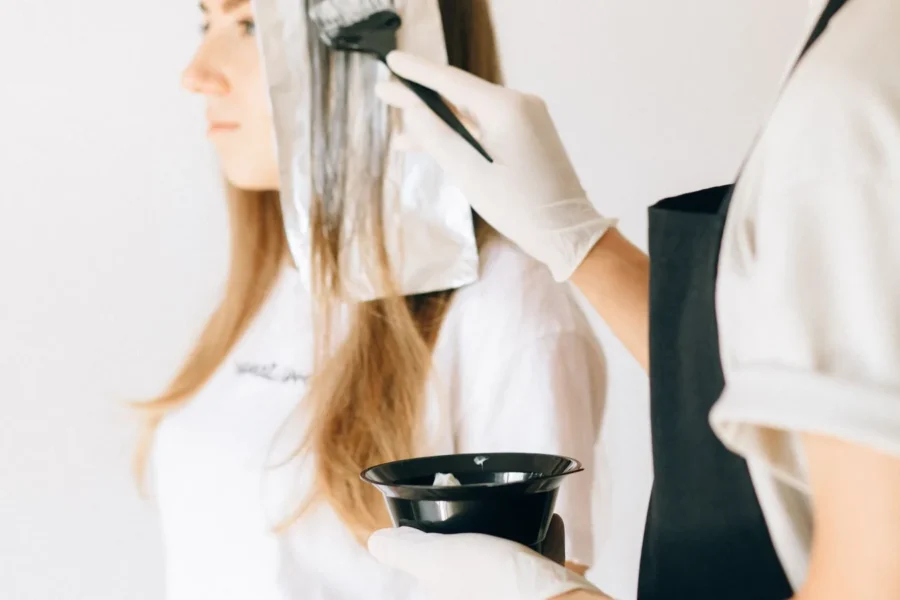 Woman choosing hair colour box beauty