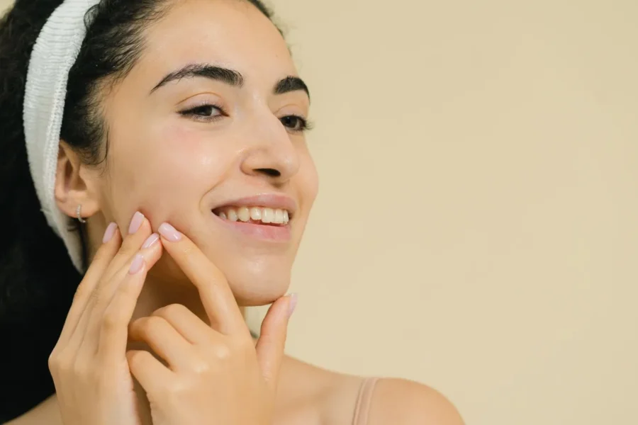 Joyful woman simple skincare colourful