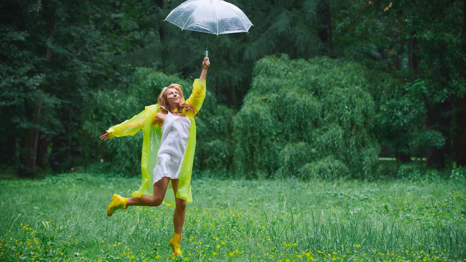 Joyful woman countryside raincoat