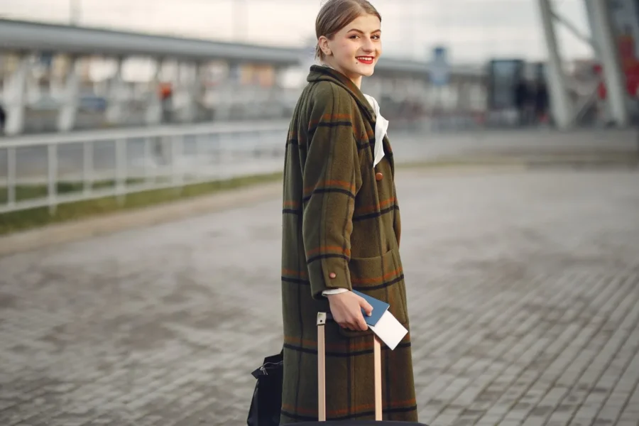 Happy stylish woman station travel