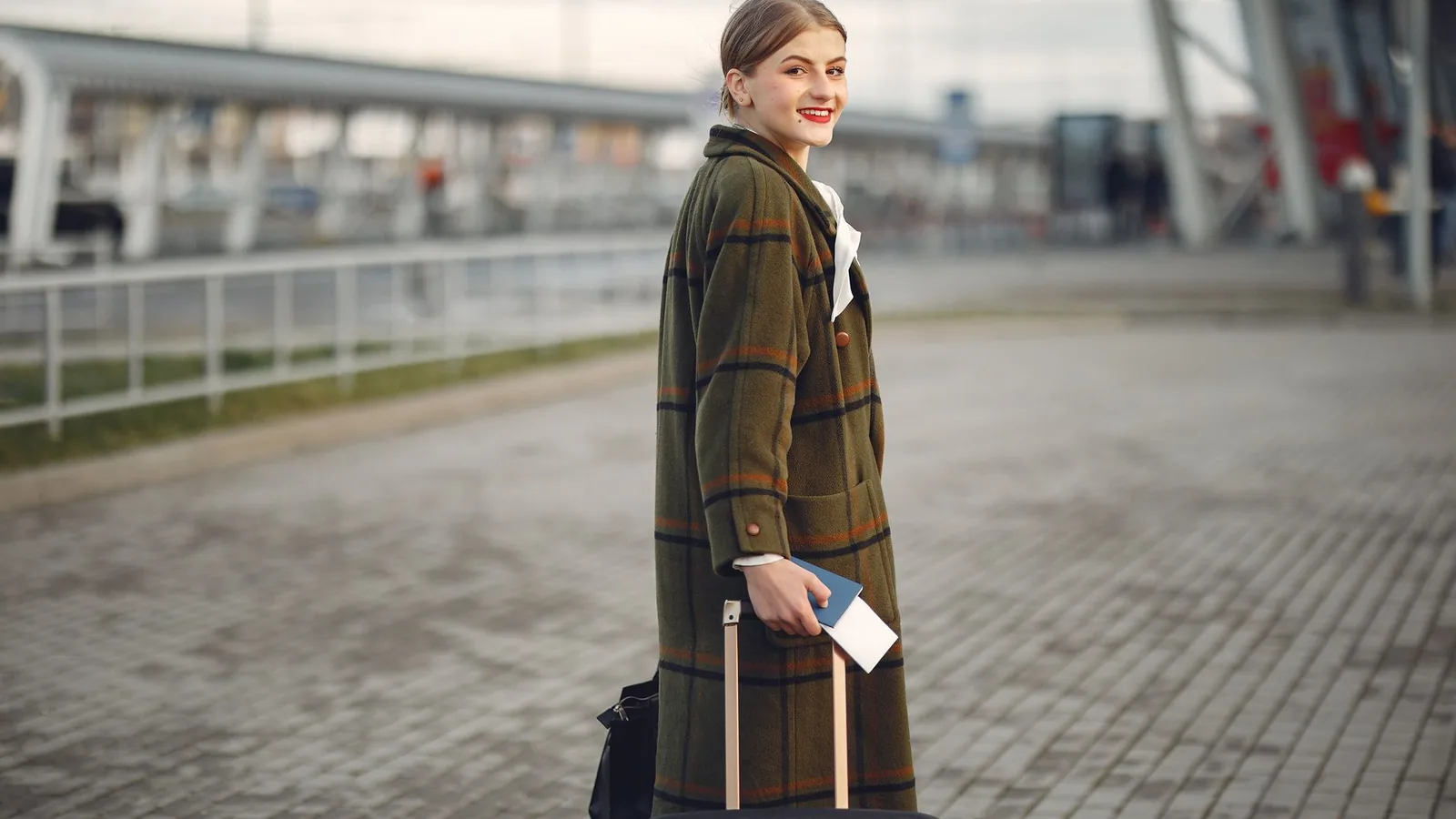 Happy stylish woman station travel