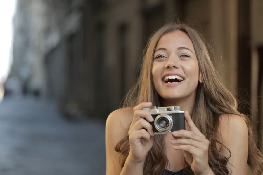 Happy woman camera travel