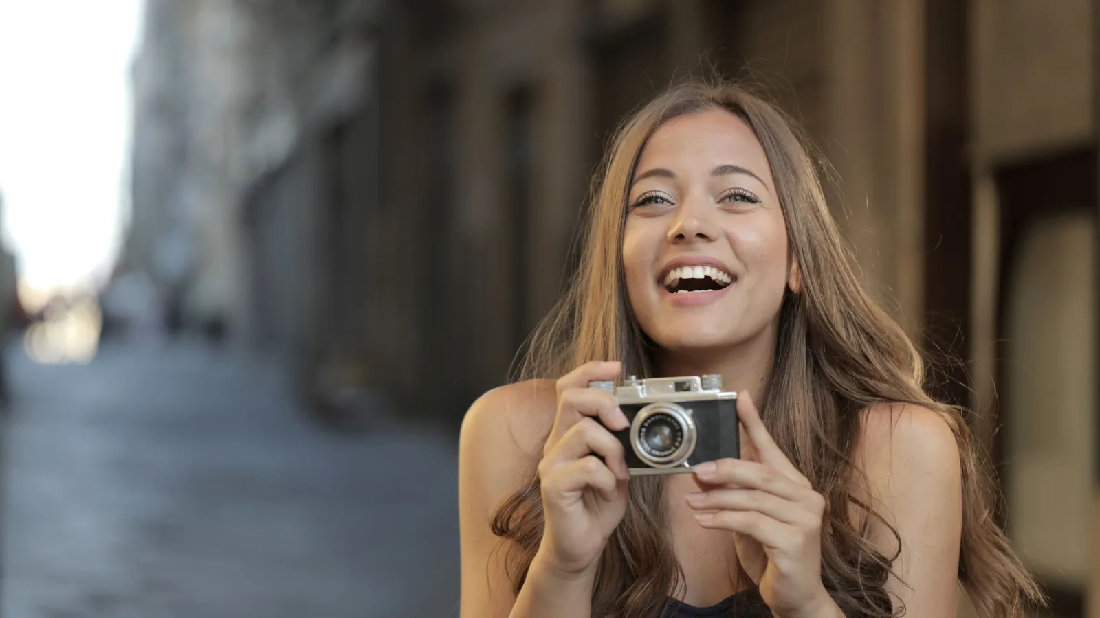 Happy woman camera travel
